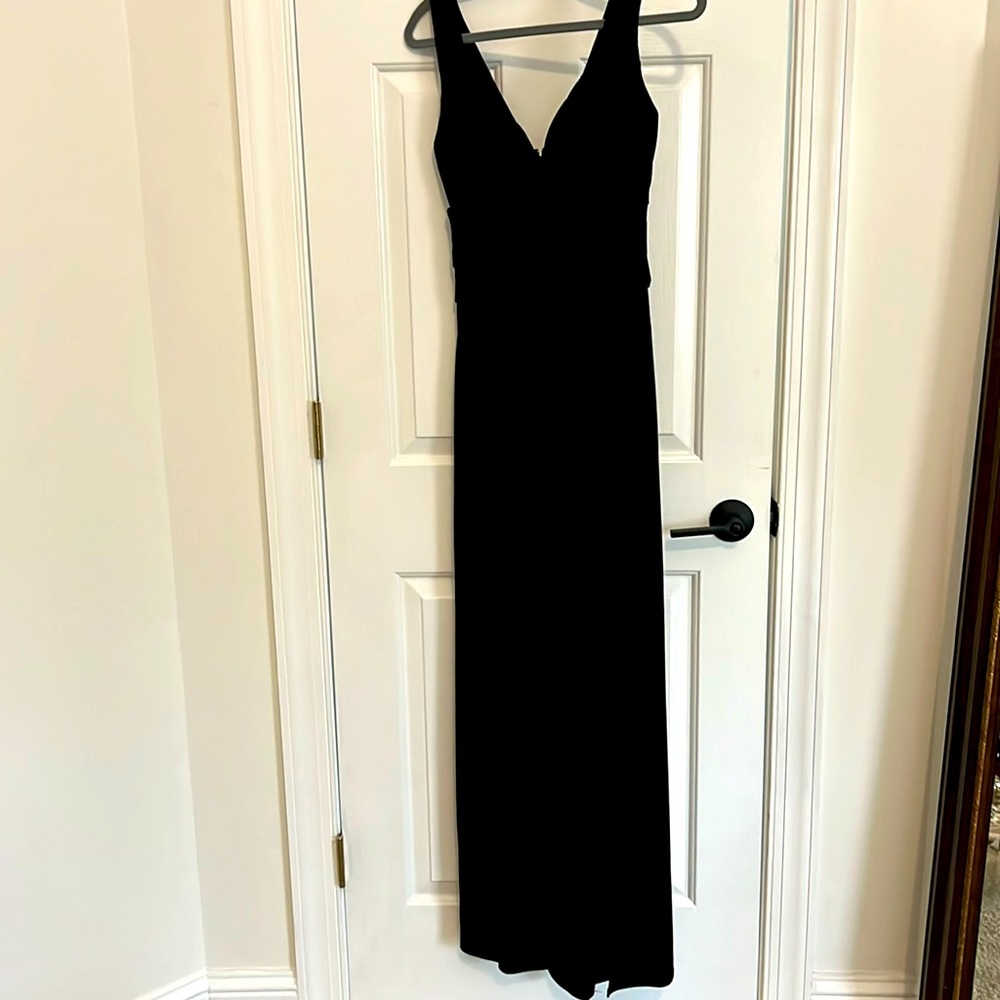 Black sleeveless formal gown with thigh-high slit